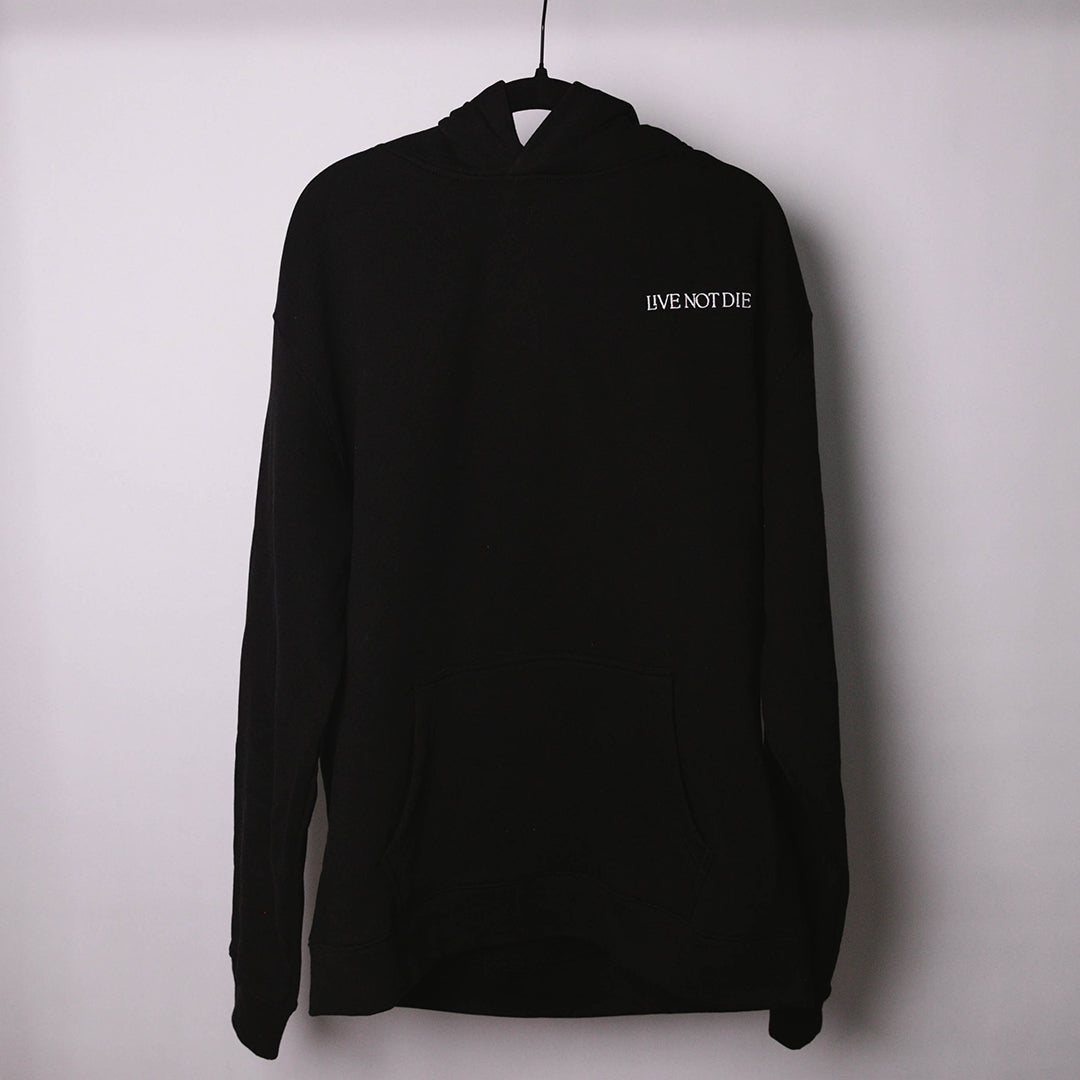 LIVE NOT DIE HOODIE AGAINS A WHITE BACKDROP