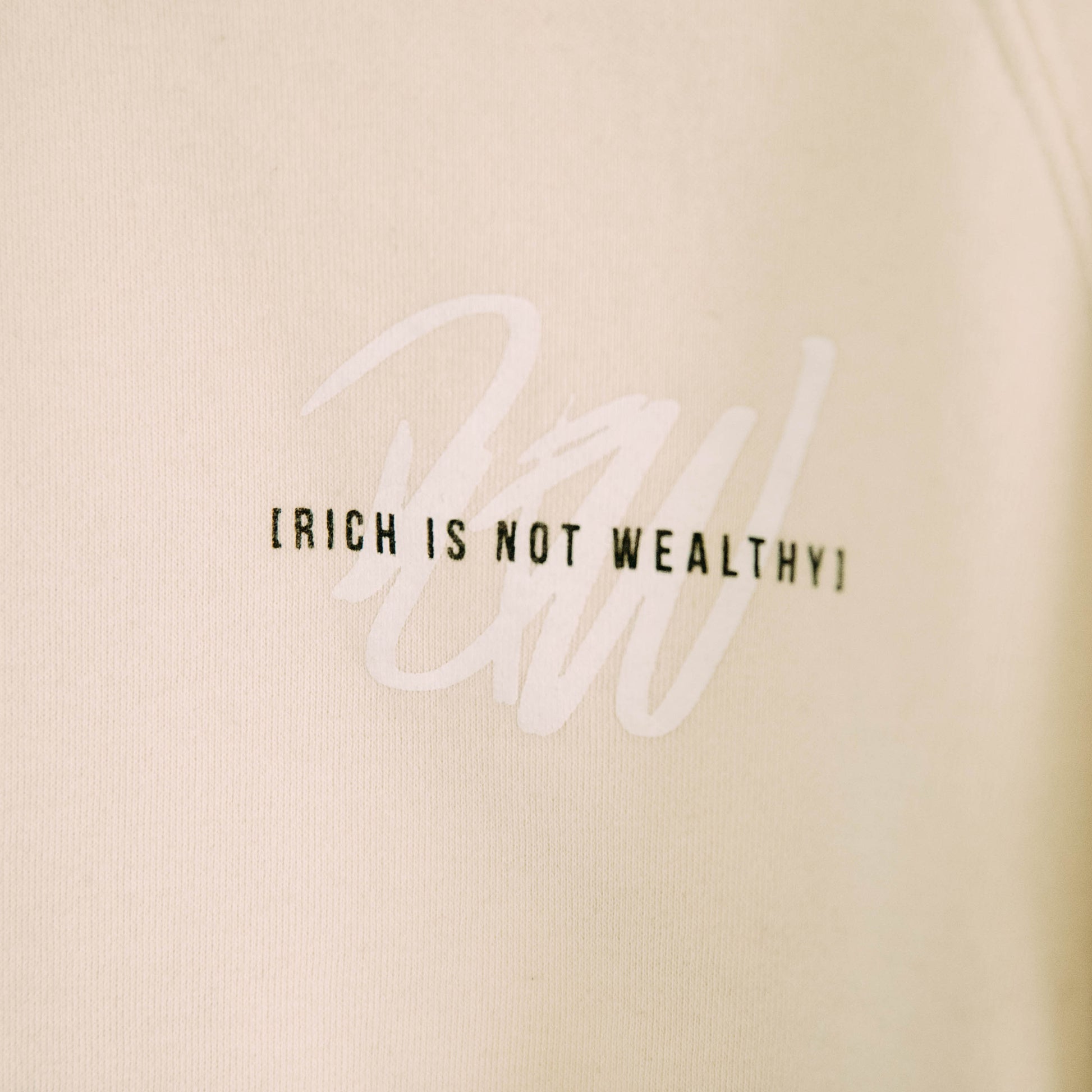 Detail shot of the front of the I will live and not die sweatshirt
