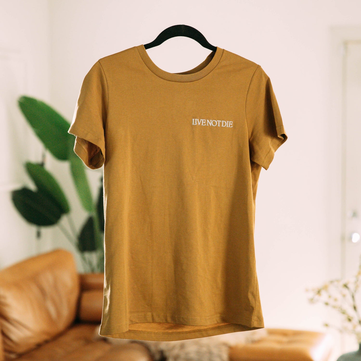 A product photo of the Live Not Die T Shirt 