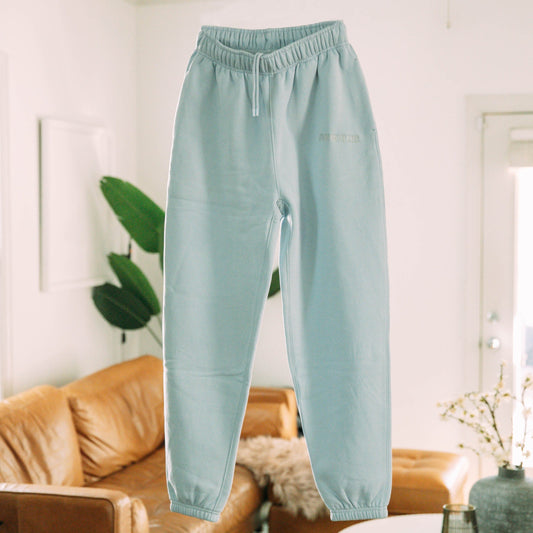 A product shot of the live not die trackpants