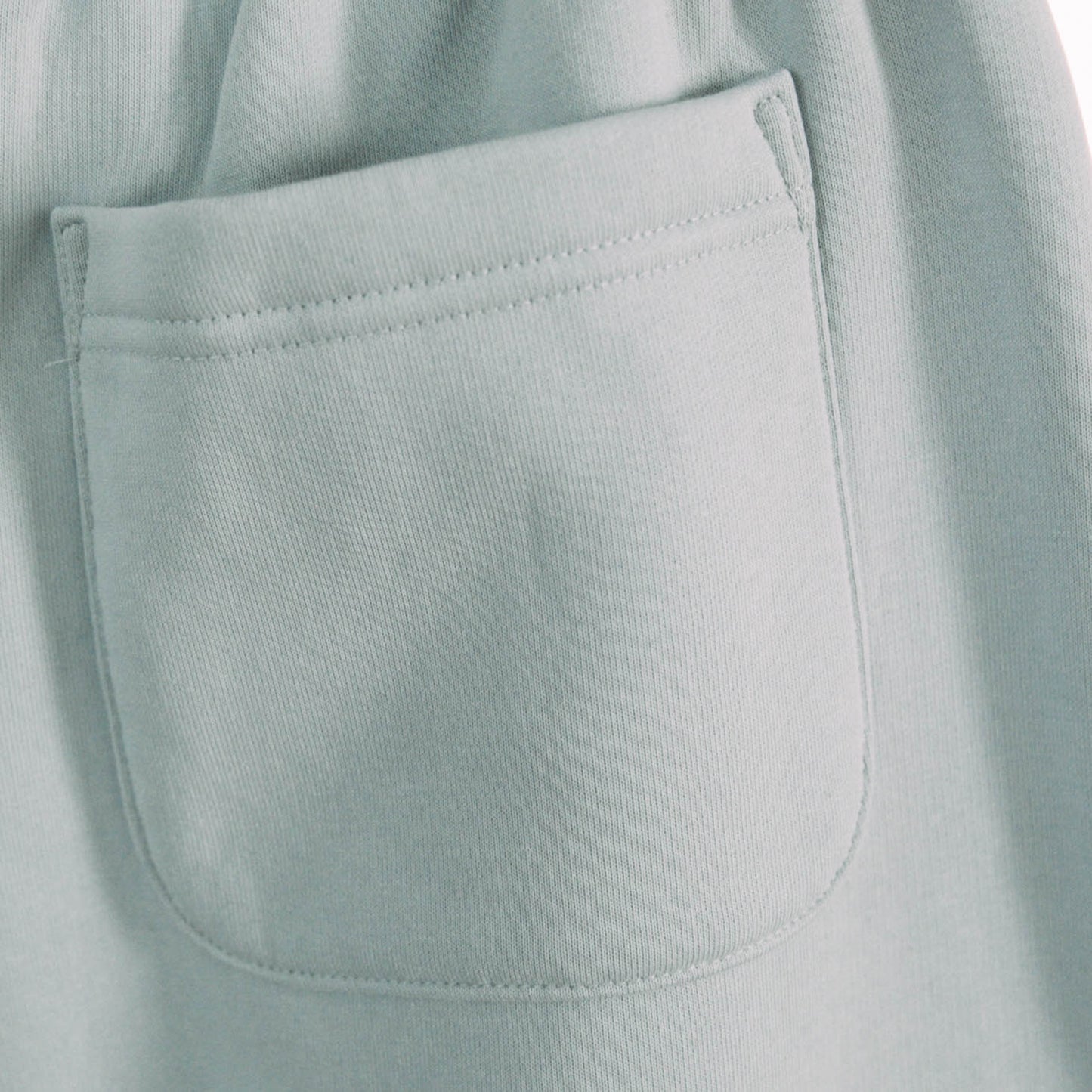 A product shot of the live not die trackpants