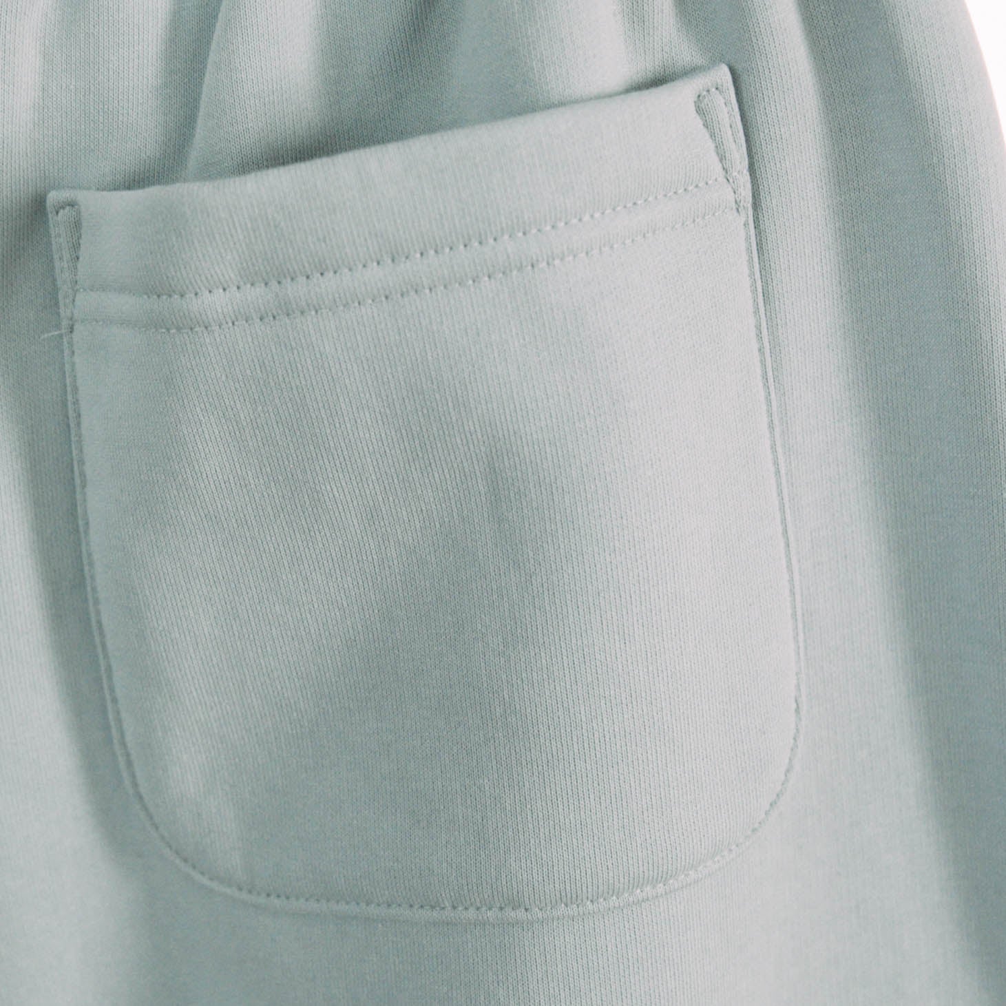 A product shot of the live not die trackpants