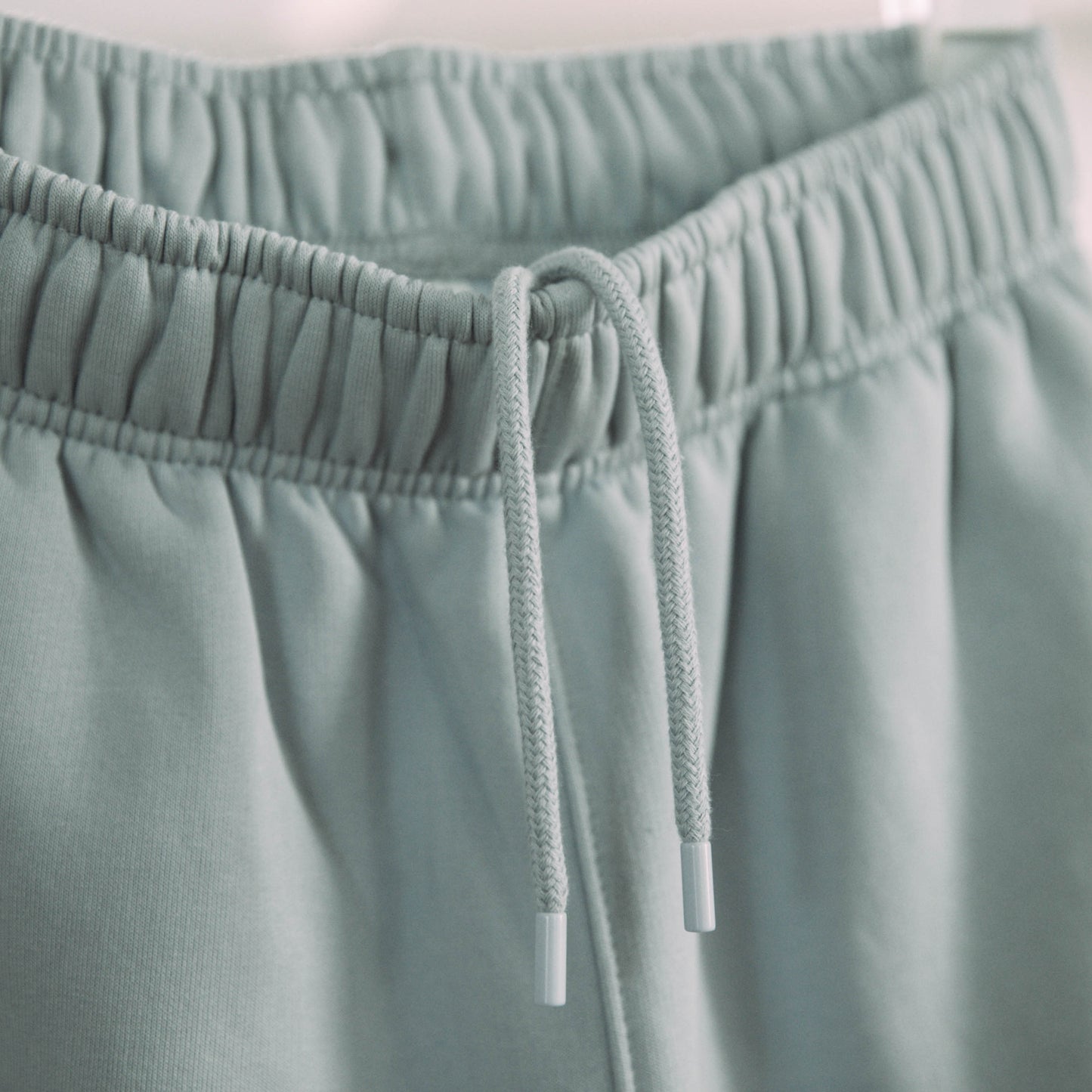 A product shot of the live not die trackpants