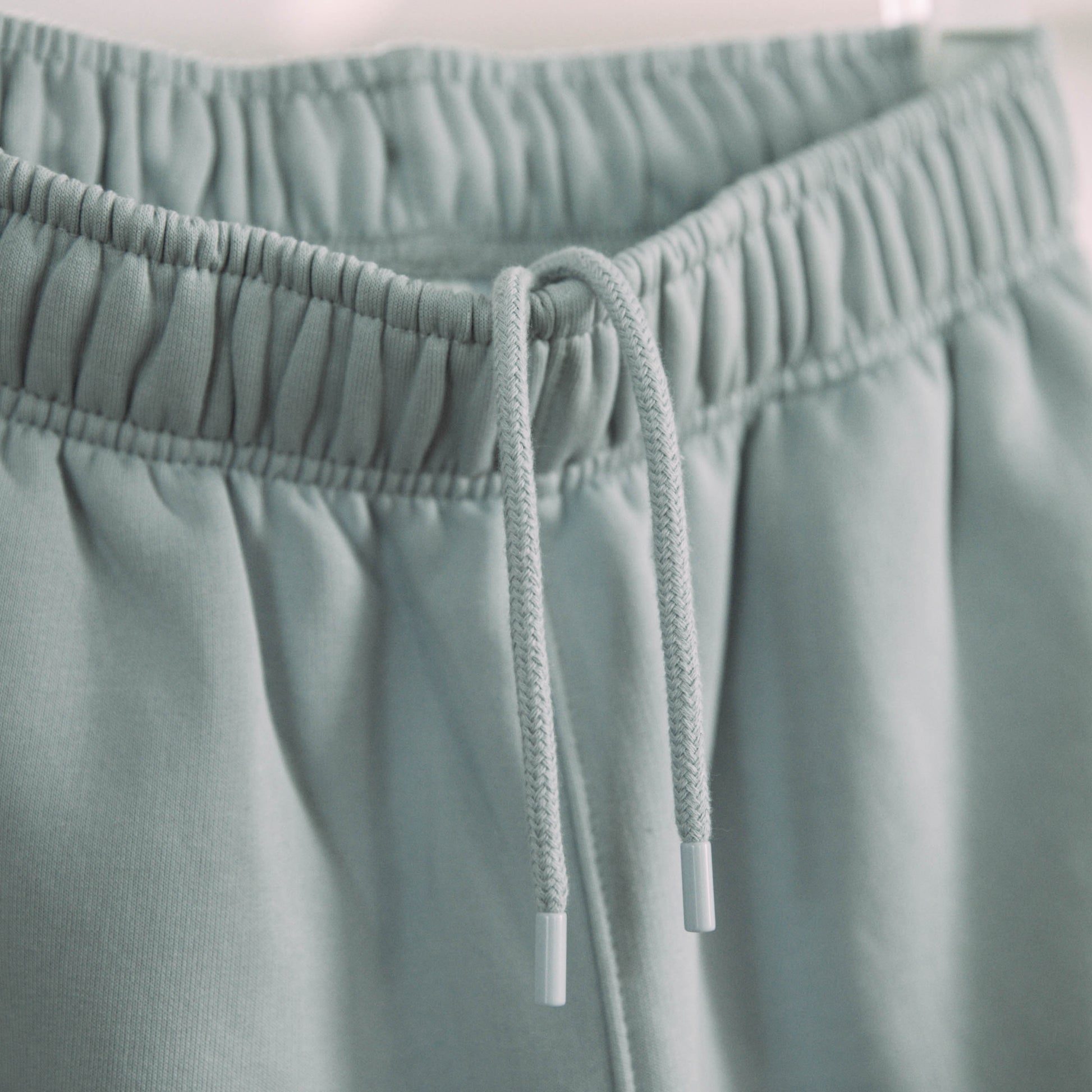 A product shot of the live not die trackpants