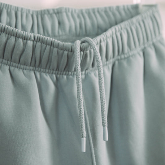 A product shot of the live not die trackpants